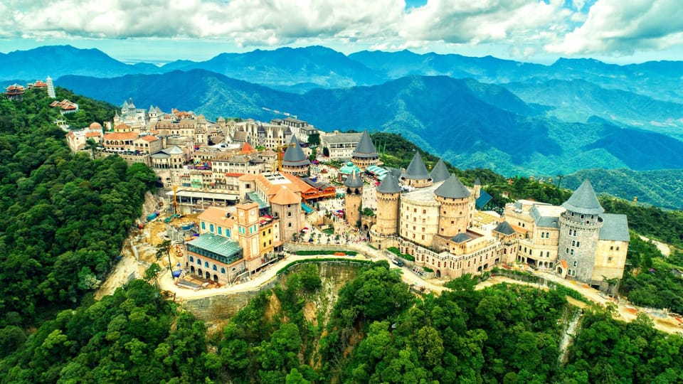 From Da Nang: Ba Na Hills Golden Bridge Private Tour & Lunch - French Village, stone church, and a street-festival mood