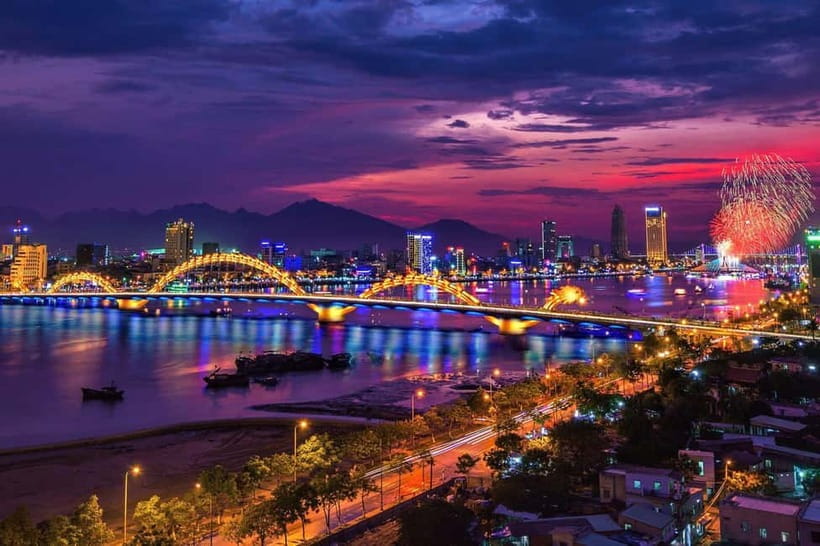 Lively Danang Sightseeing Night Tour with Local Dessert - Crossing the Dragon Bridge after dark: the big payoff